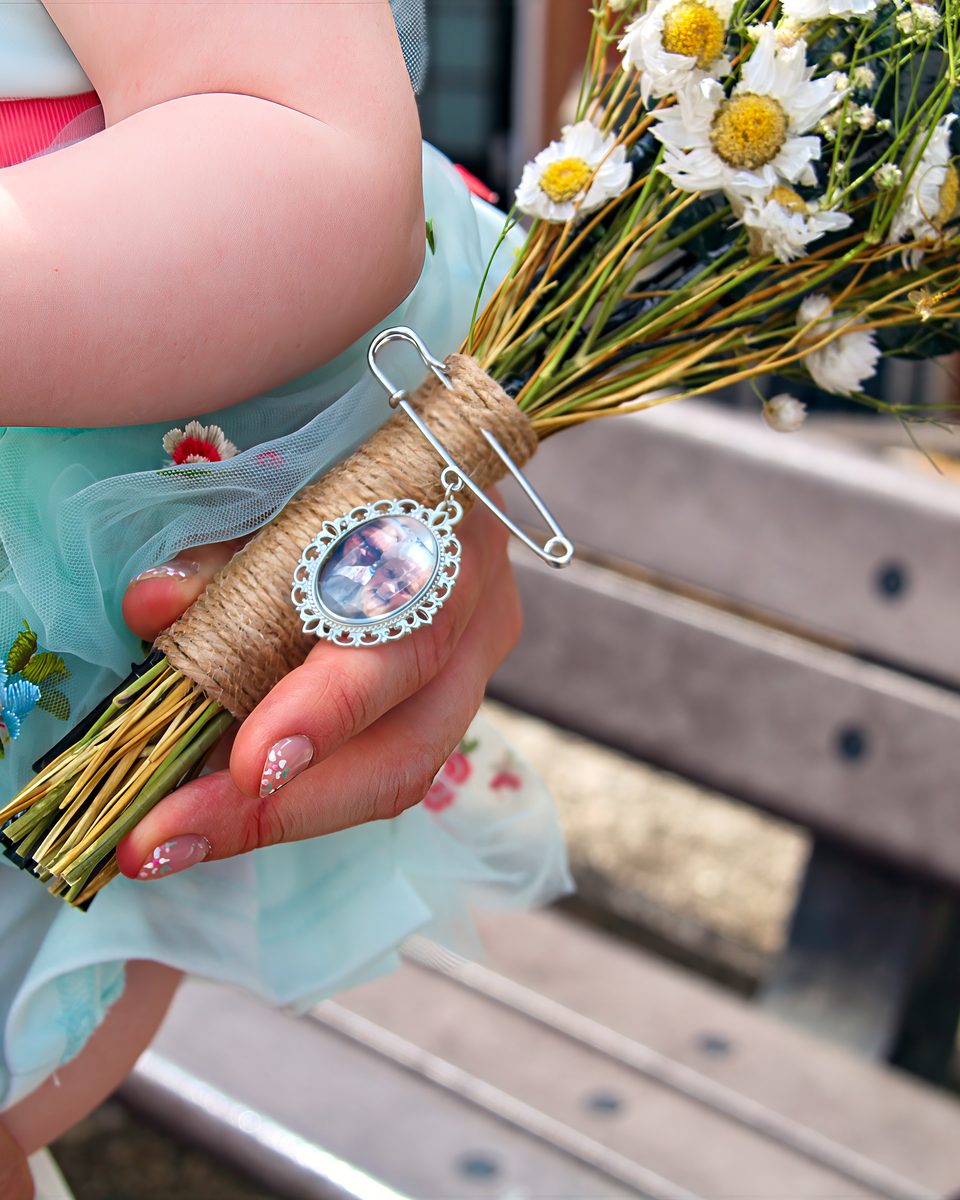 A hand-tied bouquet with a keepsake locket